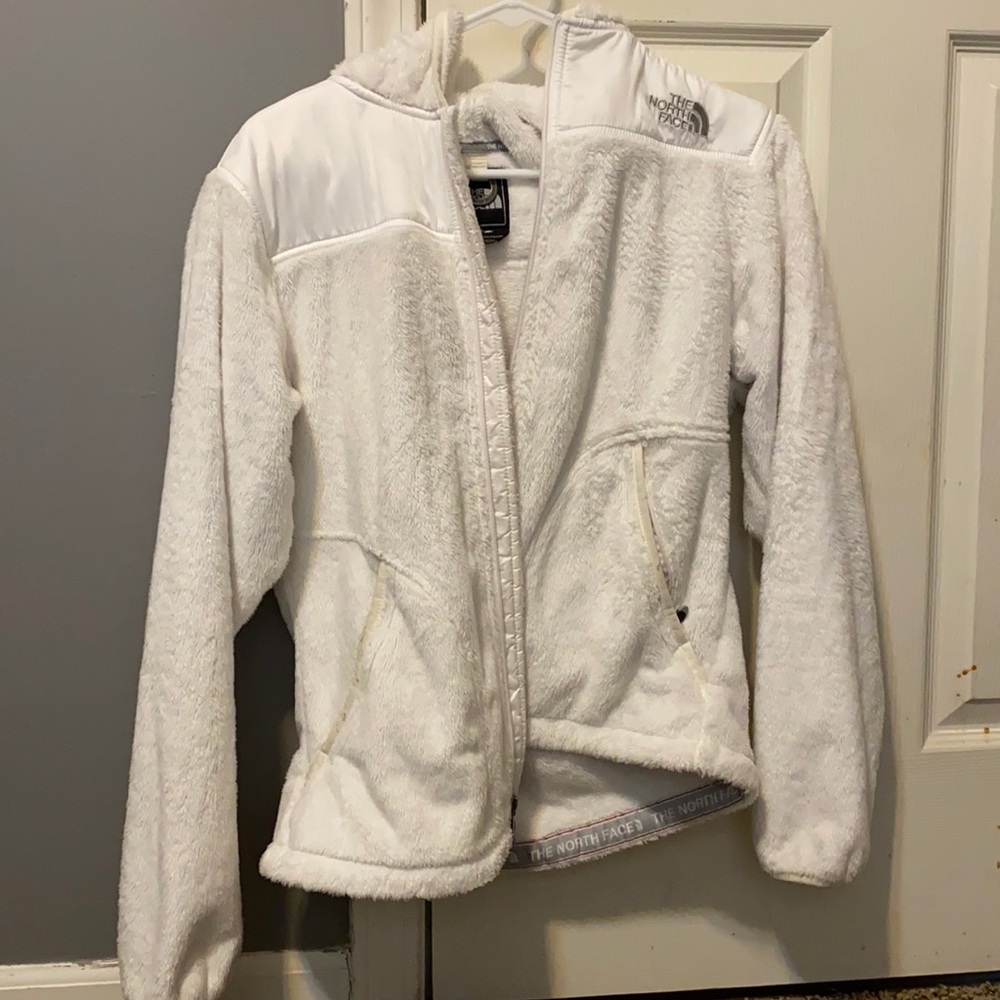 White fuzzy north face jacket